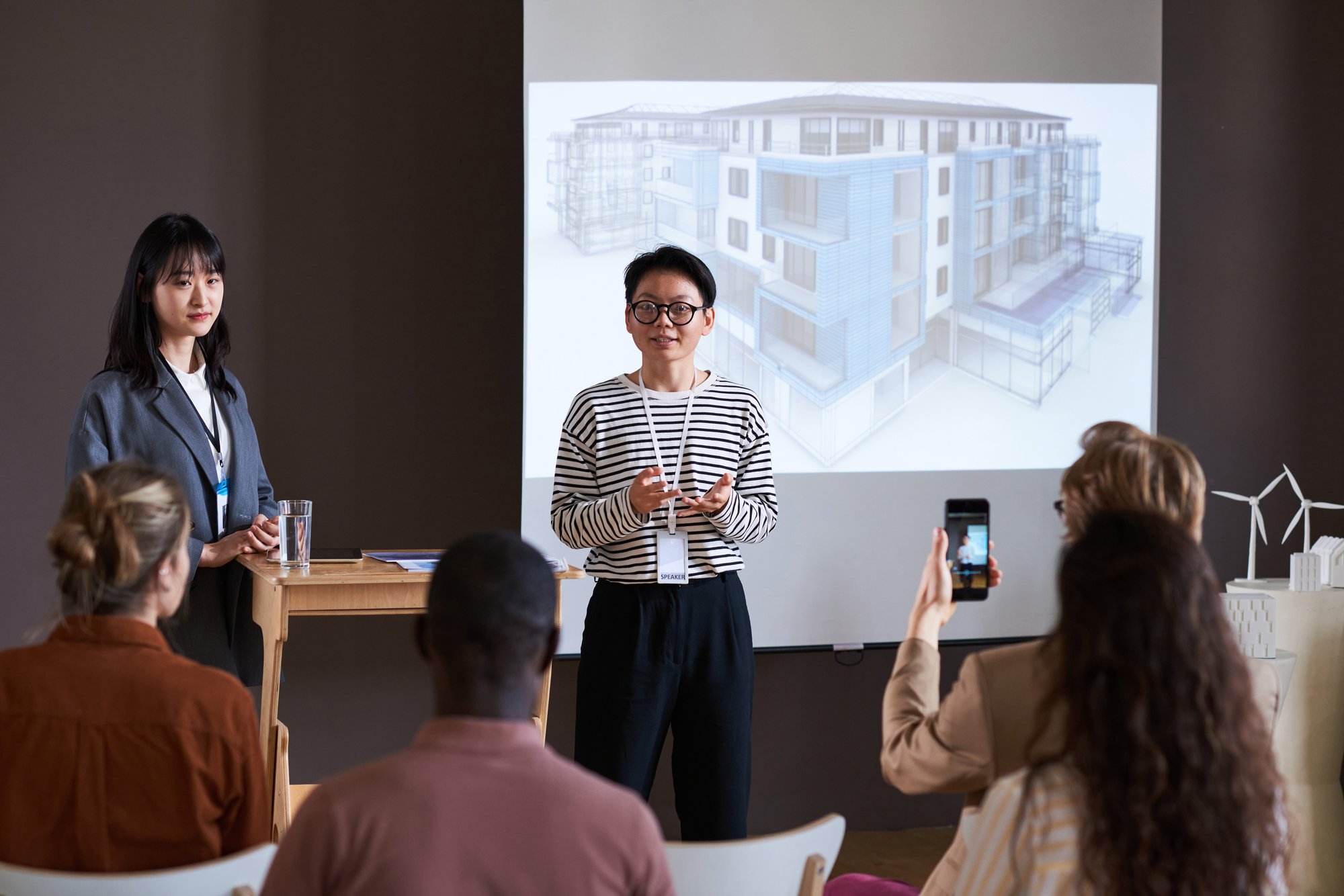 businesswoman-holding-presentation-for-business-pe-2023-11-27-05-37-07-utc