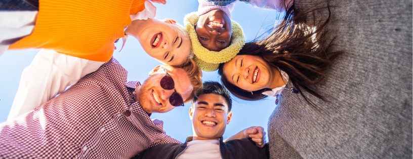 low-angle-view-of-united-multiracial-young-friends-2023-11-27-05-05-15-utc 1