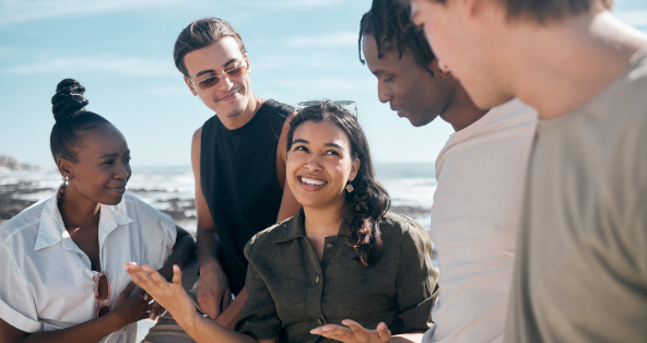 woman-talking-and-bonding-friends-by-beach-ocean-2023-11-27-05-26-47-utc 1